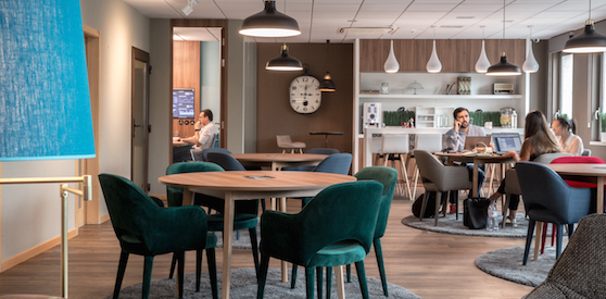people working in the business lounge
